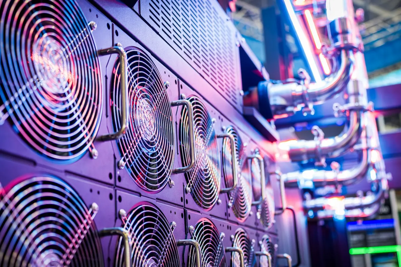 Rows of illuminated servers in a data center