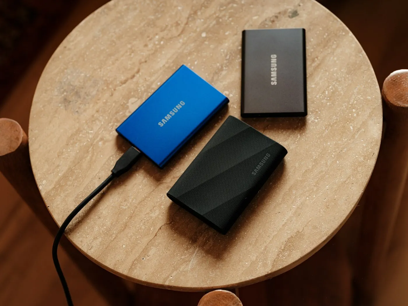 An external hard drive connected with cables on a desk
