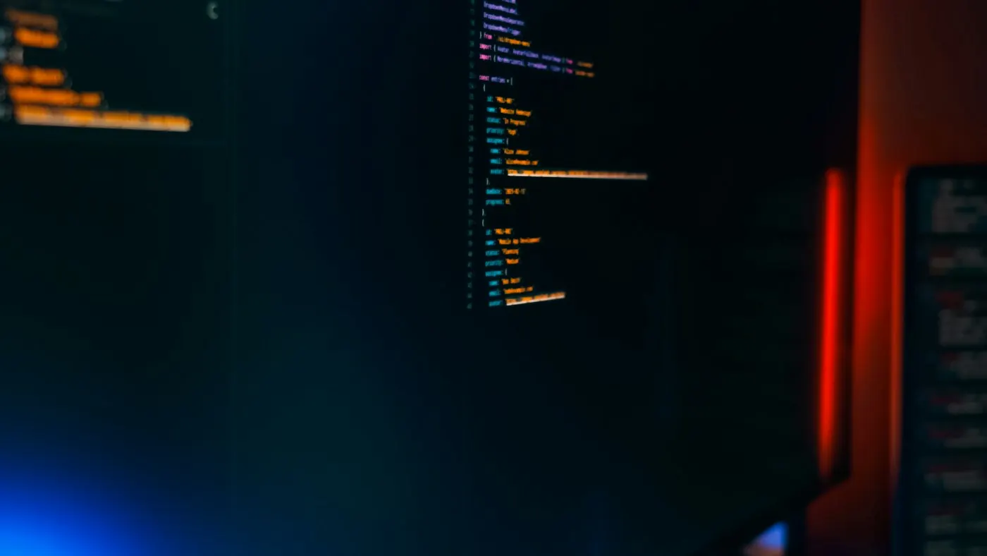 Lines of code displayed on a dark computer monitor