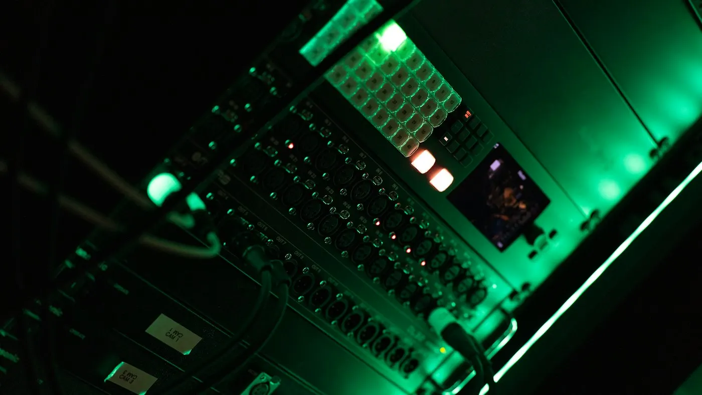 Rows of illuminated servers in a data center