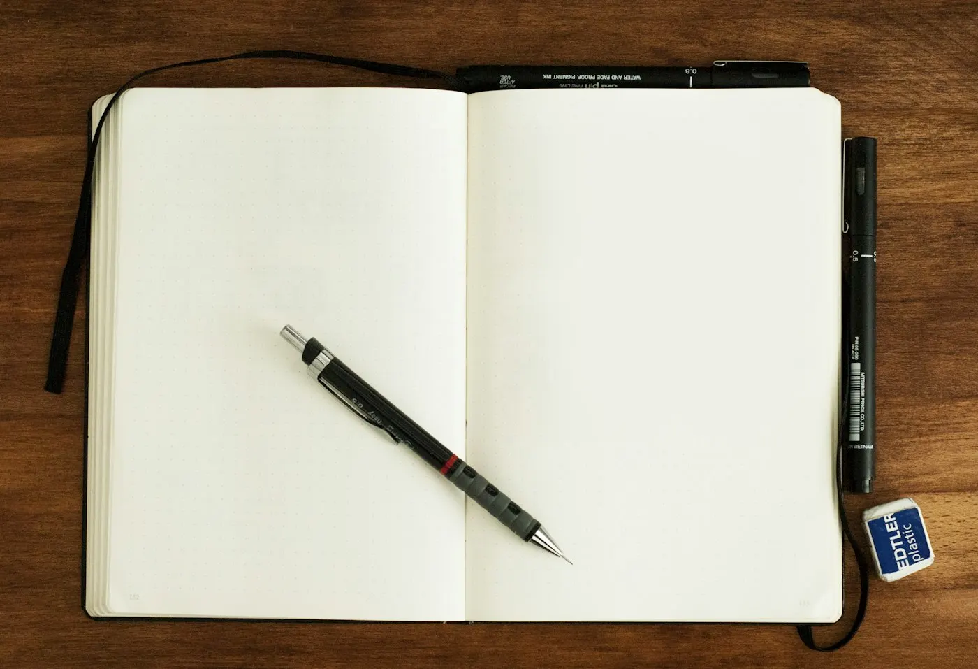 A hand-drawn website wireframe sketch in a notebook