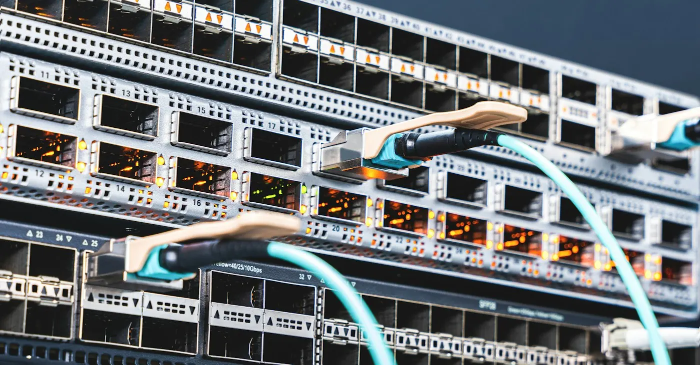 Thick data cables plugged into a server rack