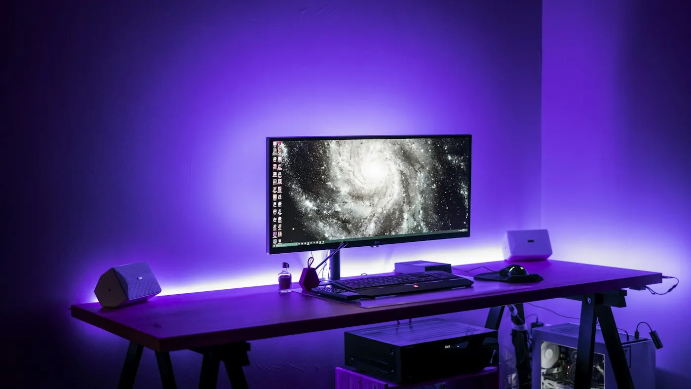 A gaming monitor and keyboard on a desk
