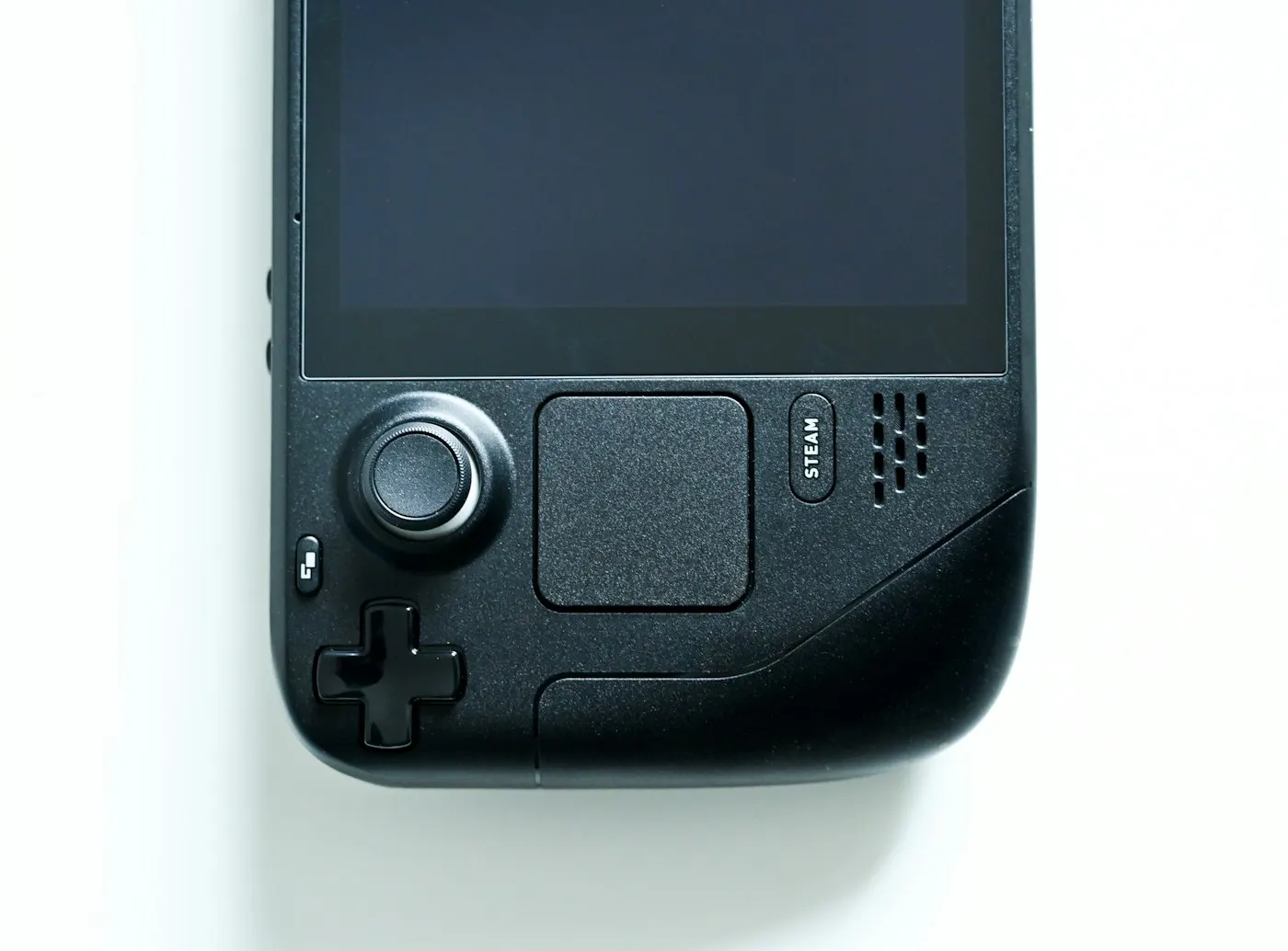 Close-up of a handheld gaming device's analog sticks and buttons