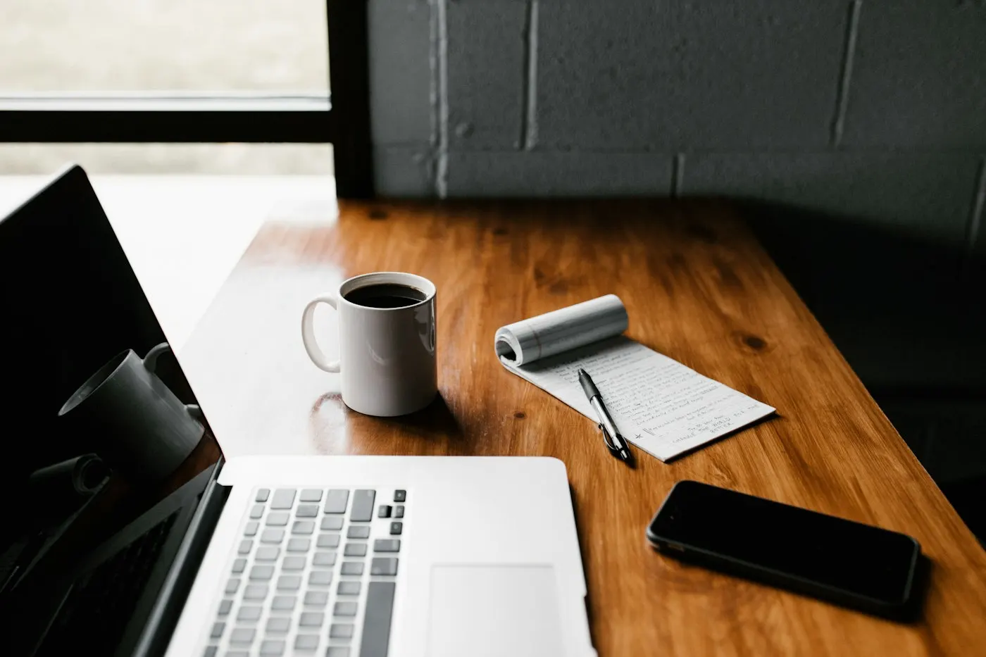 An open laptop on a desk in an office