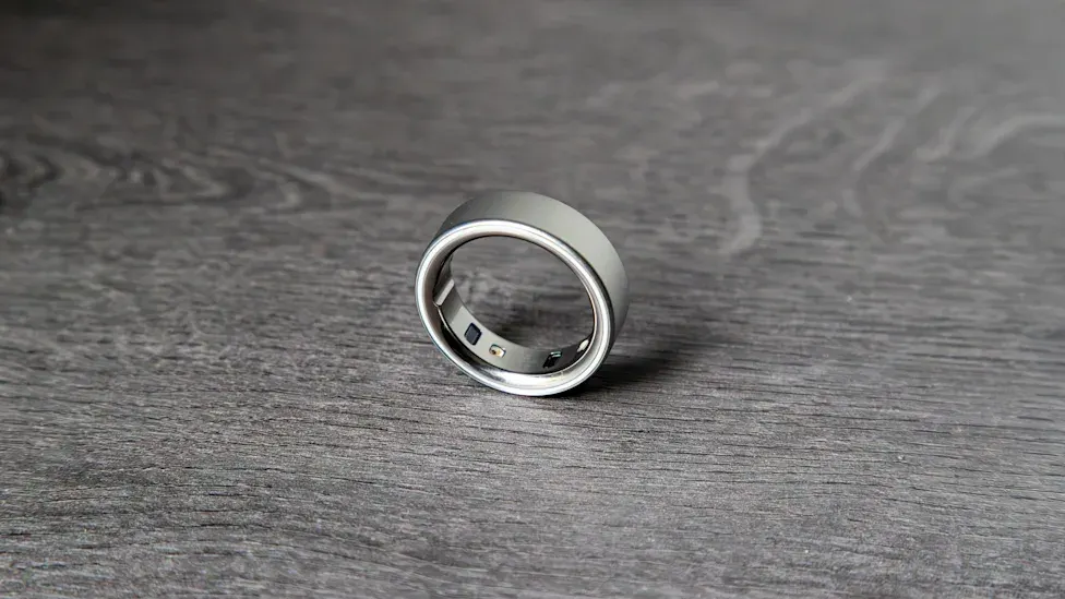 The Oura Ring 5 shown from multiple angles, highlighting its slim 2.28mm profile and finish options