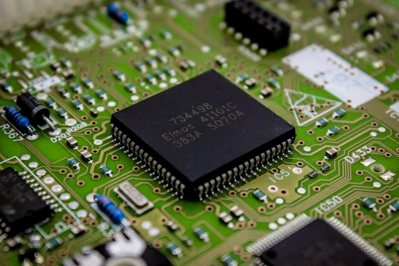 Macro close-up of a circuit board with chip components