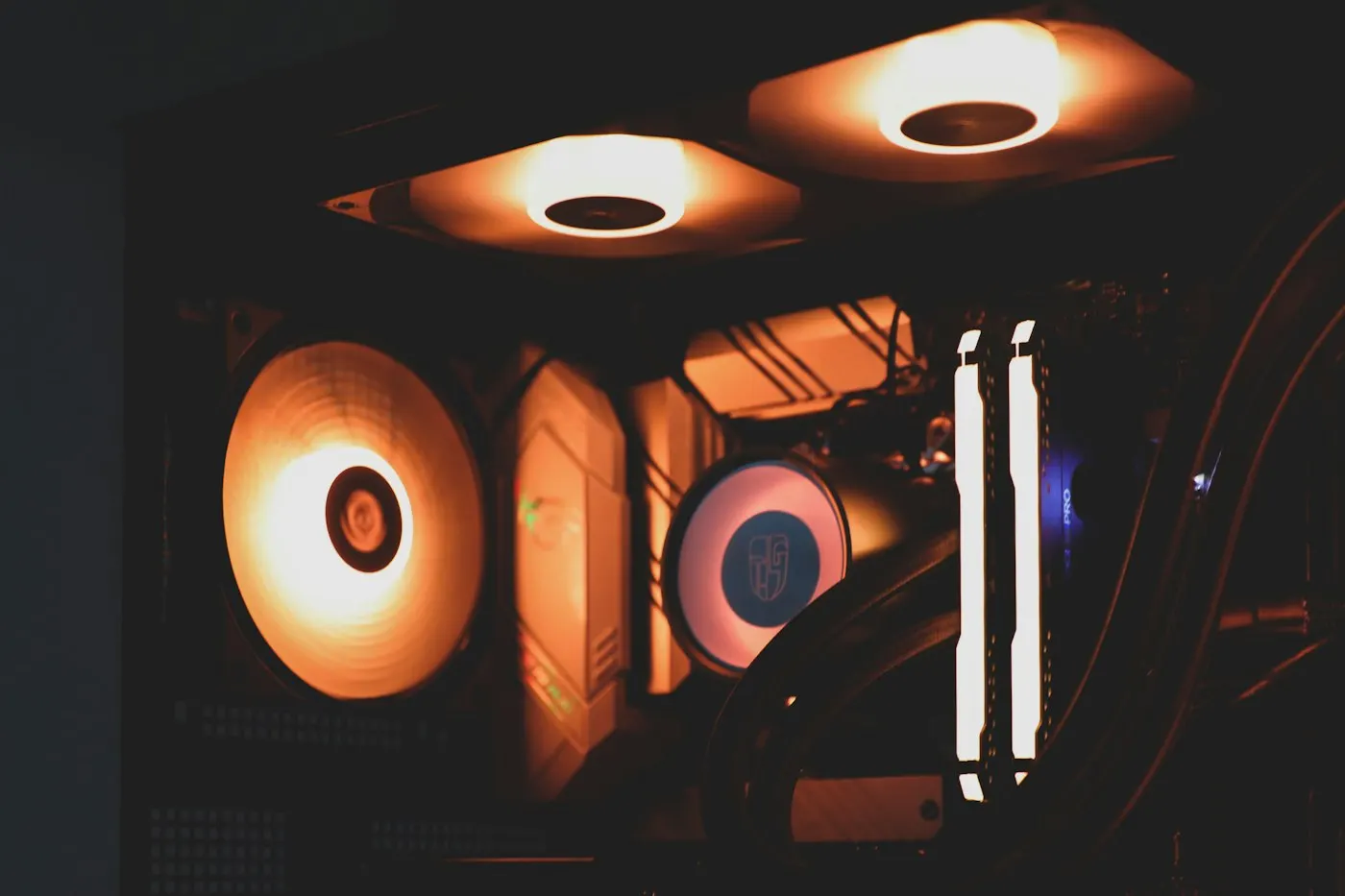 Inside of a gaming PC case with cable lighting
