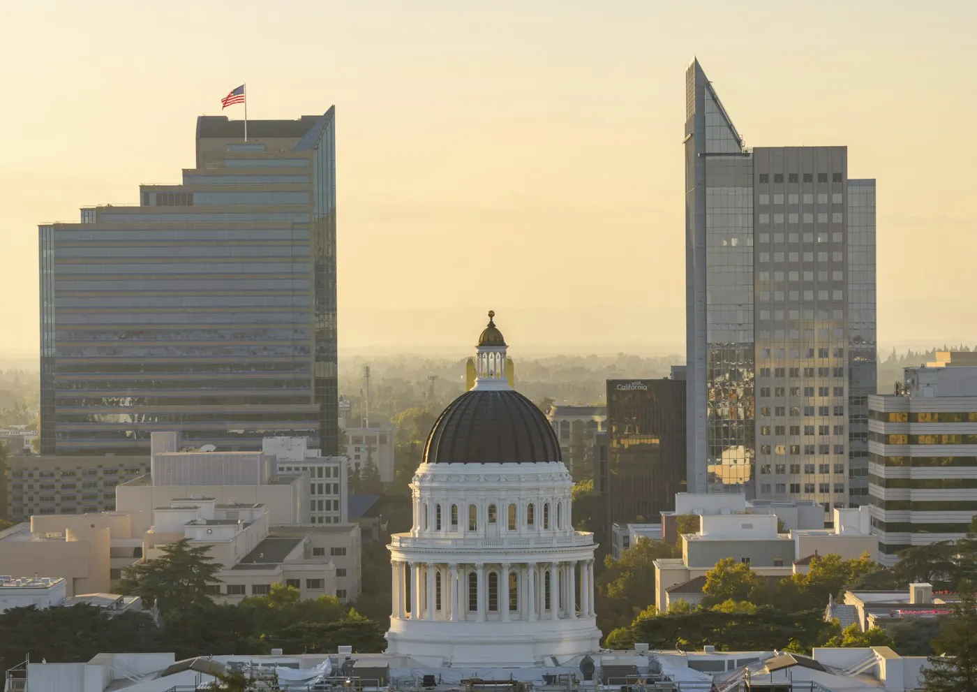 A government capitol dome lit at dusk