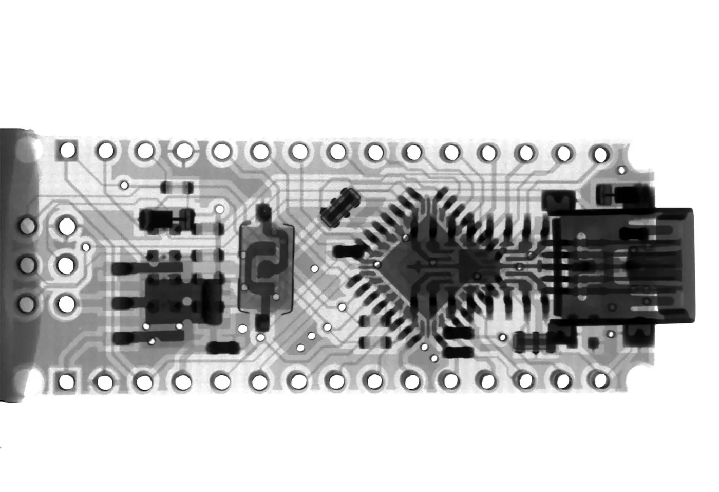 A robotic hand reaching toward a glowing circuit board