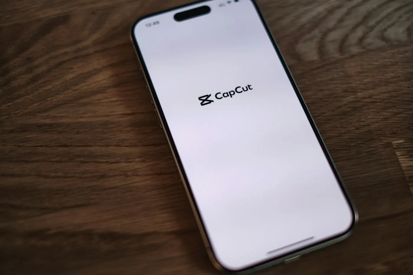 CapCut mobile interface on iPhone showing a vertical video edit with auto-captions displayed on screen. Bright, colourful UI. Show the AI tools panel open.