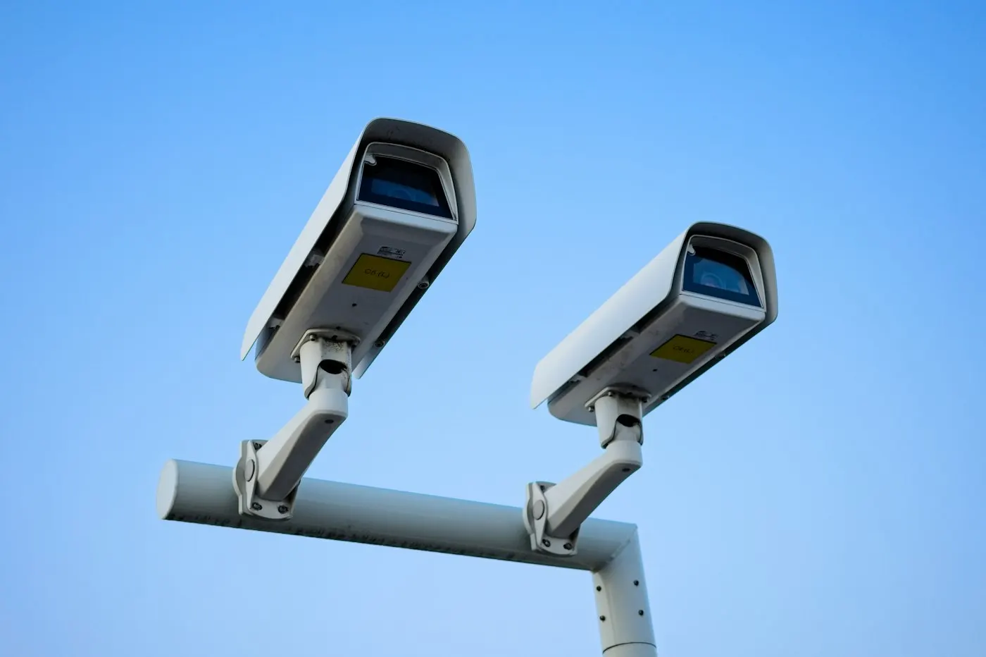A traffic camera mounted on a roadside pole