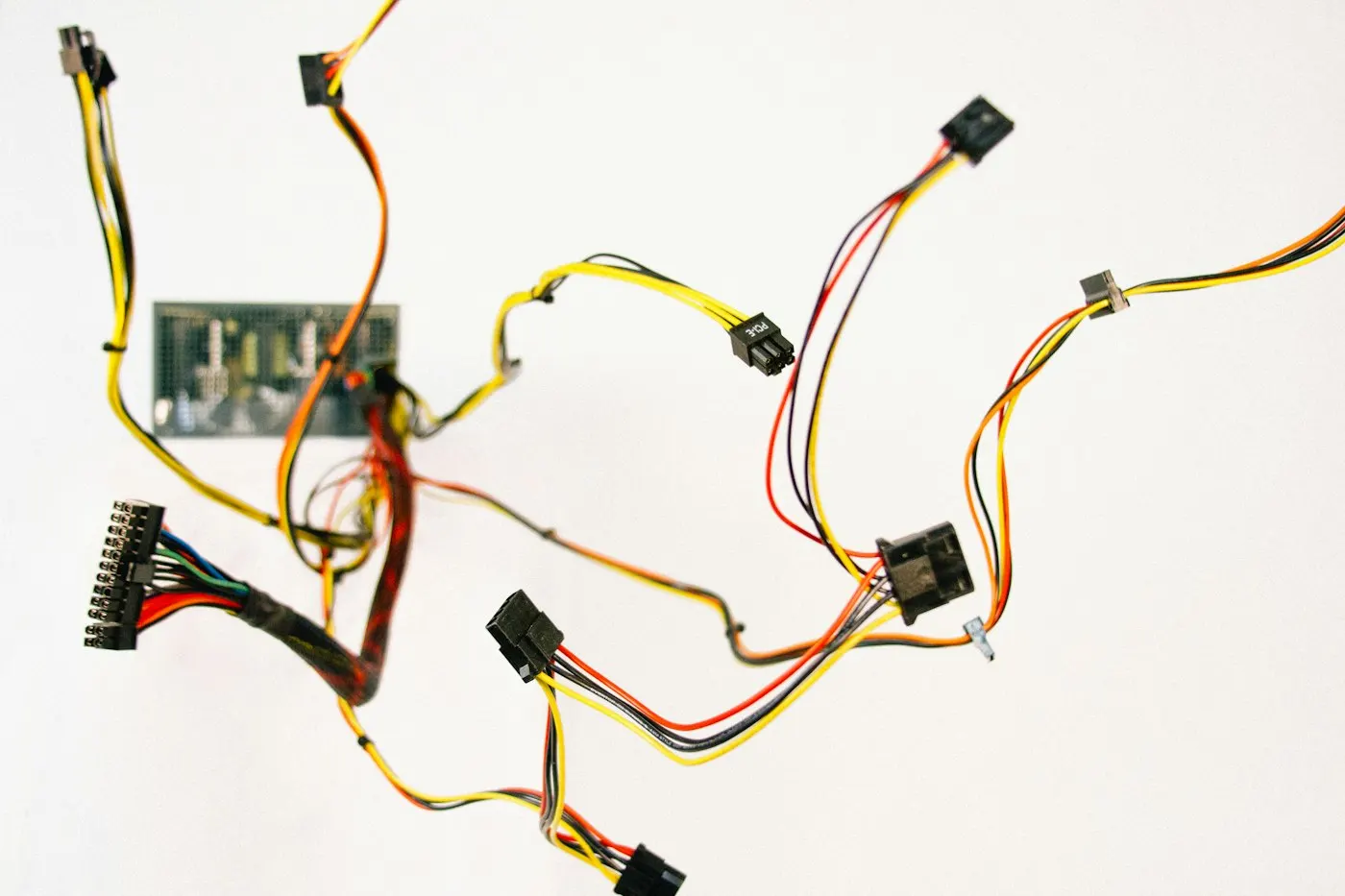 Cables plugged into the back of a computer monitor