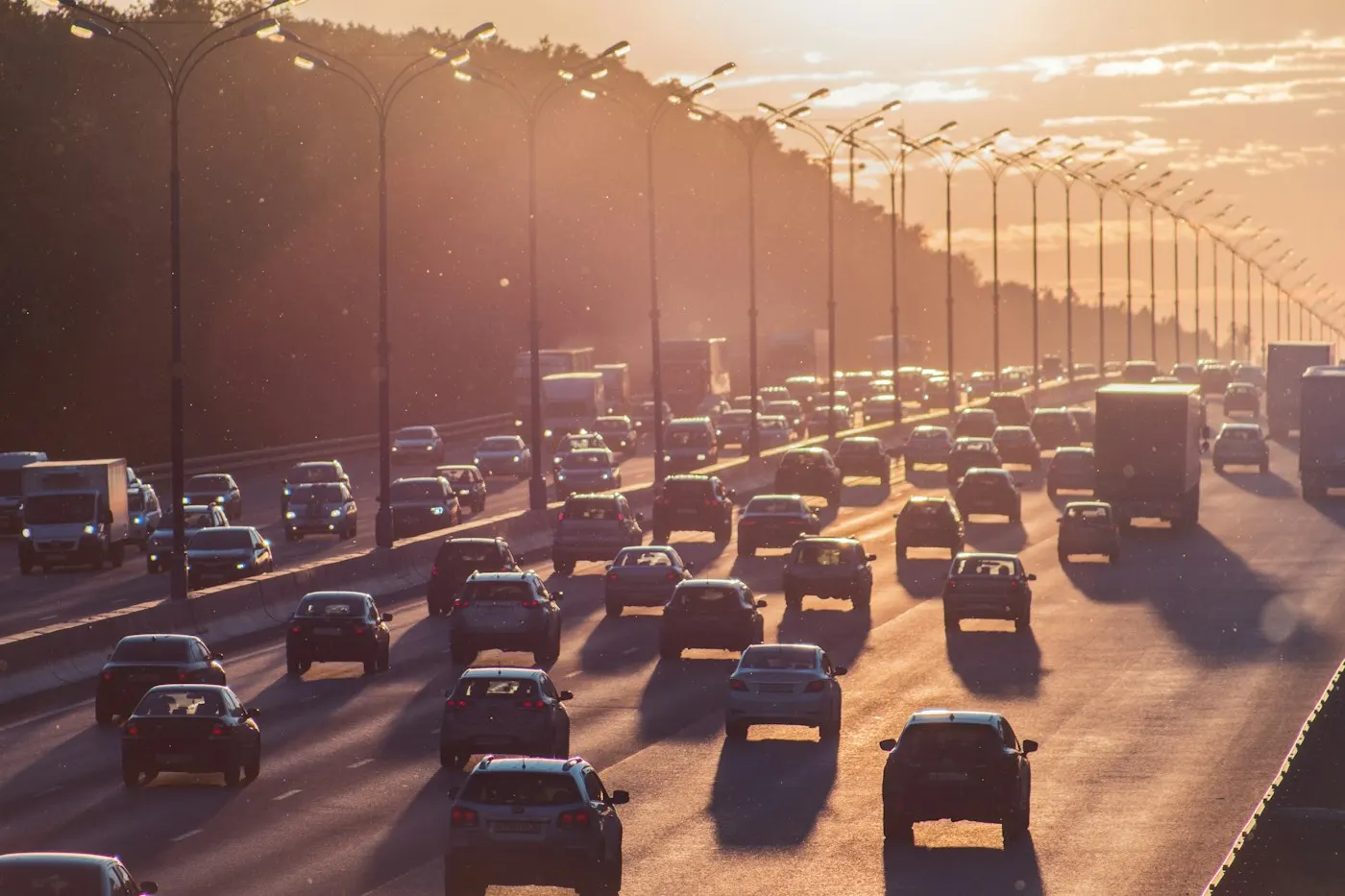 Cars driving on a highway during daytime traffic