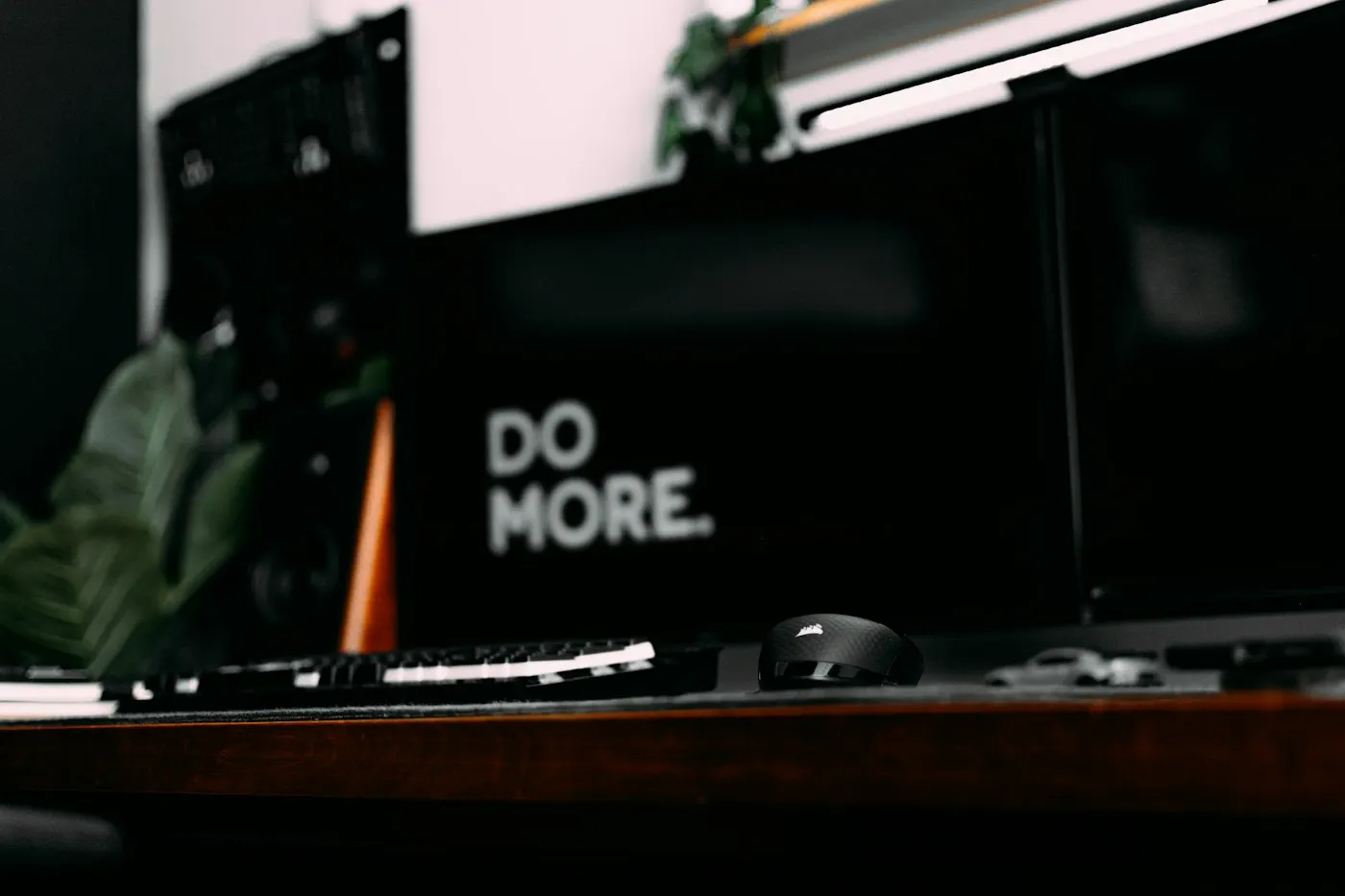 A desk with dual monitors showing code