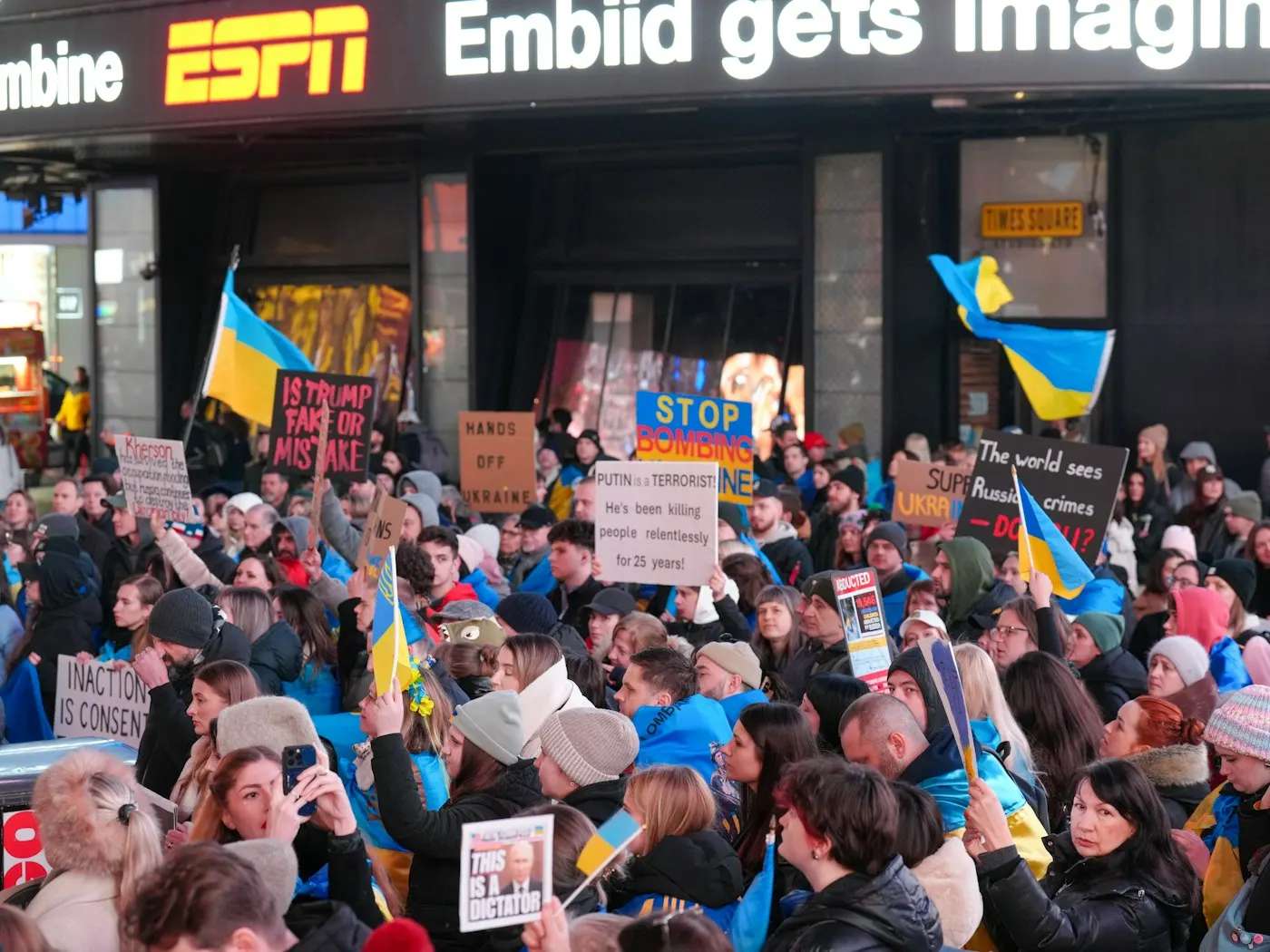 People holding signs during a street rally