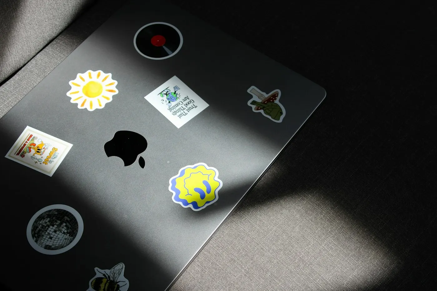 Laptop covered in stickers used by an open source contributor