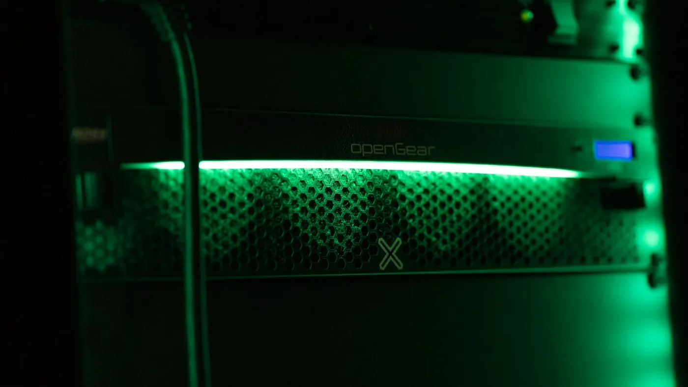 Rows of illuminated servers in a data center