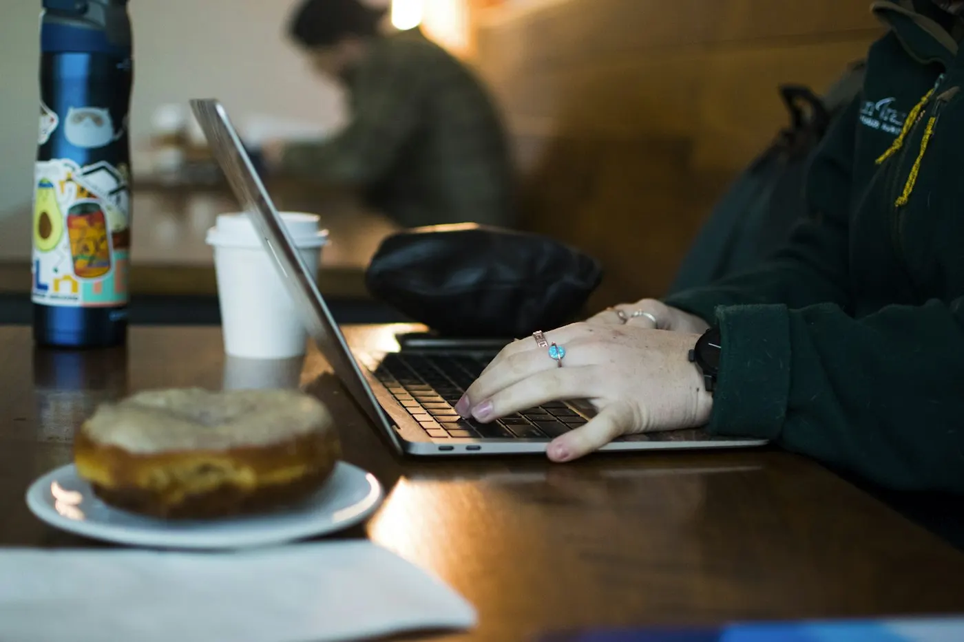Person using a laptop at a table