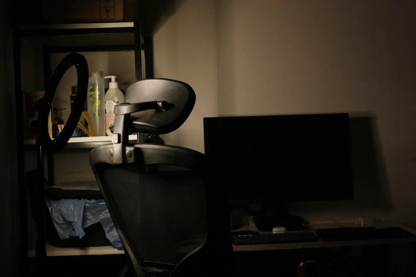 A virtual reality headset resting in a dark room