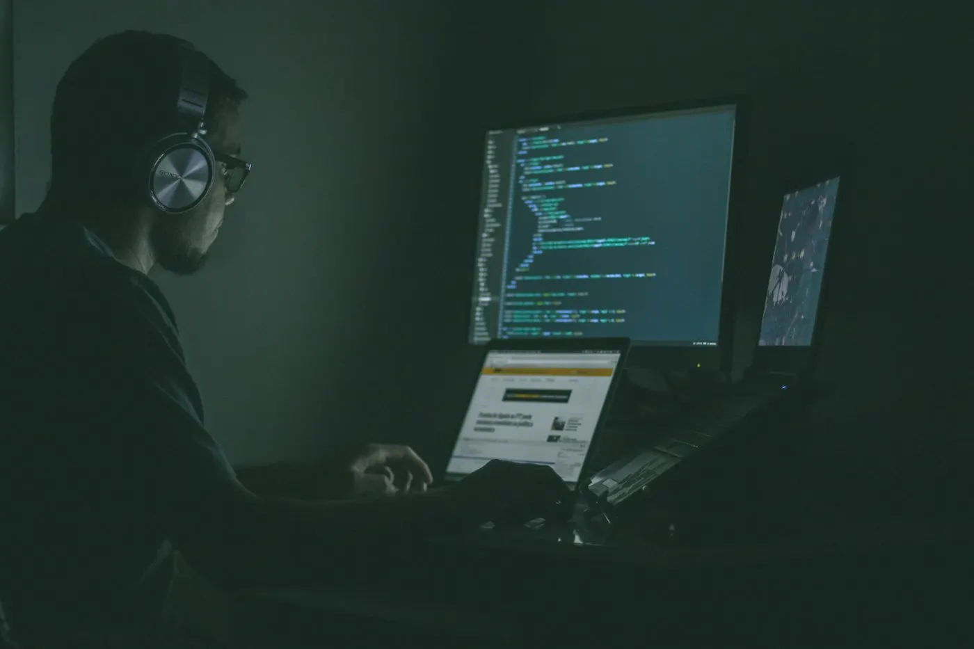 Developer working at a dual monitor setup