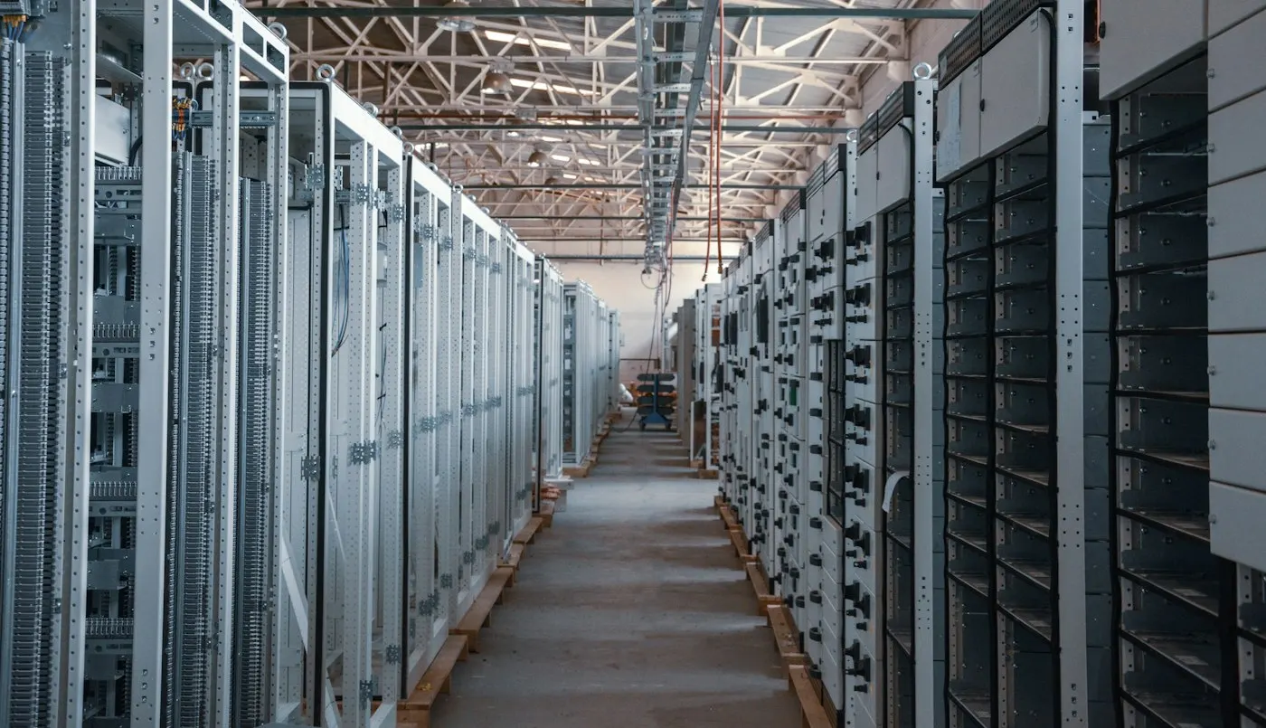 Rows of server racks in a data center corridor