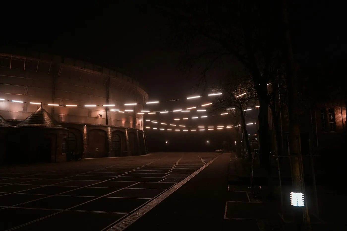 Floodlights illuminating an empty stadium at night