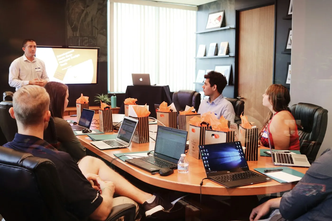 A small office team discussing documents together