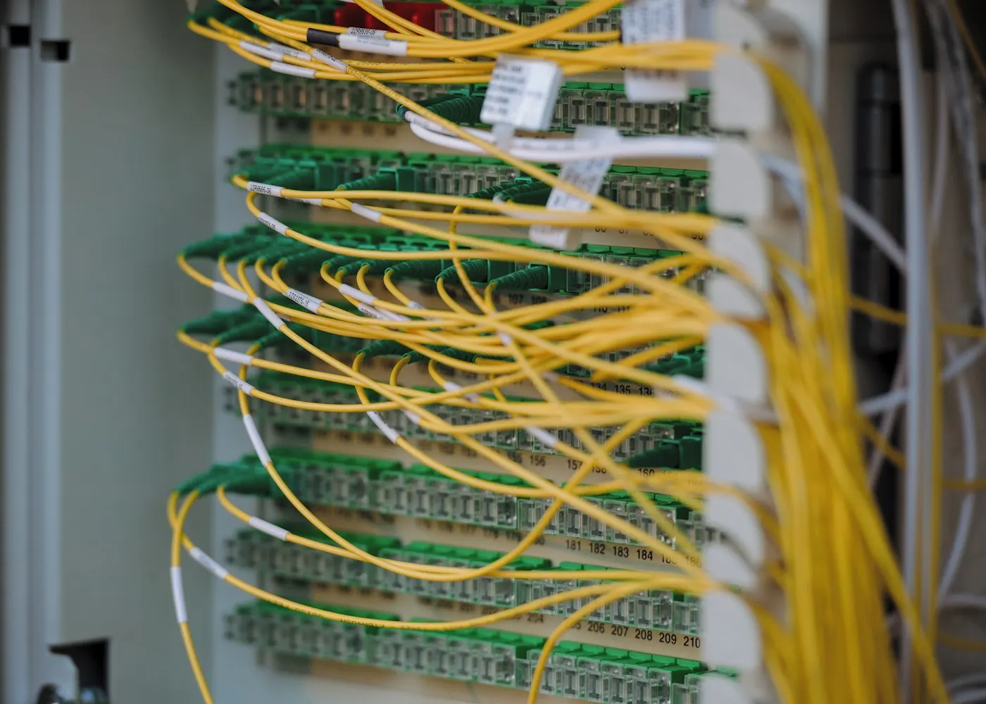 Rows of illuminated servers in a data center
