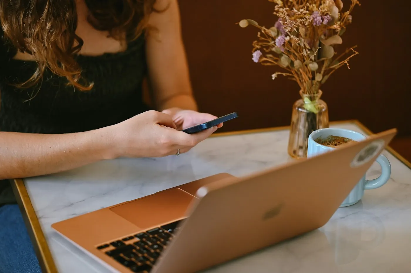 Person typing on a laptop at a table