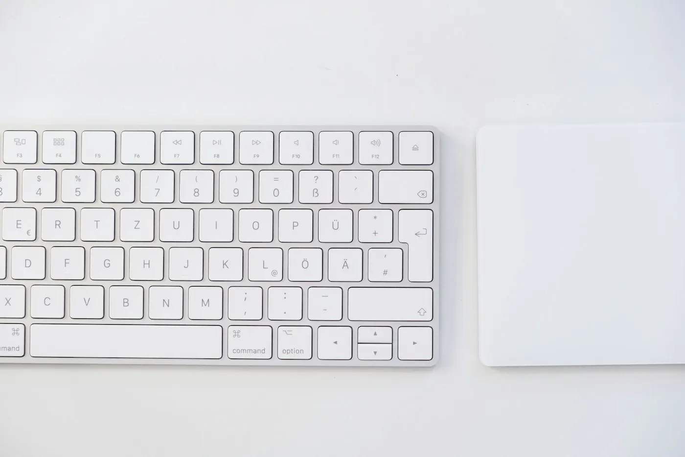 A credit card resting beside a computer keyboard