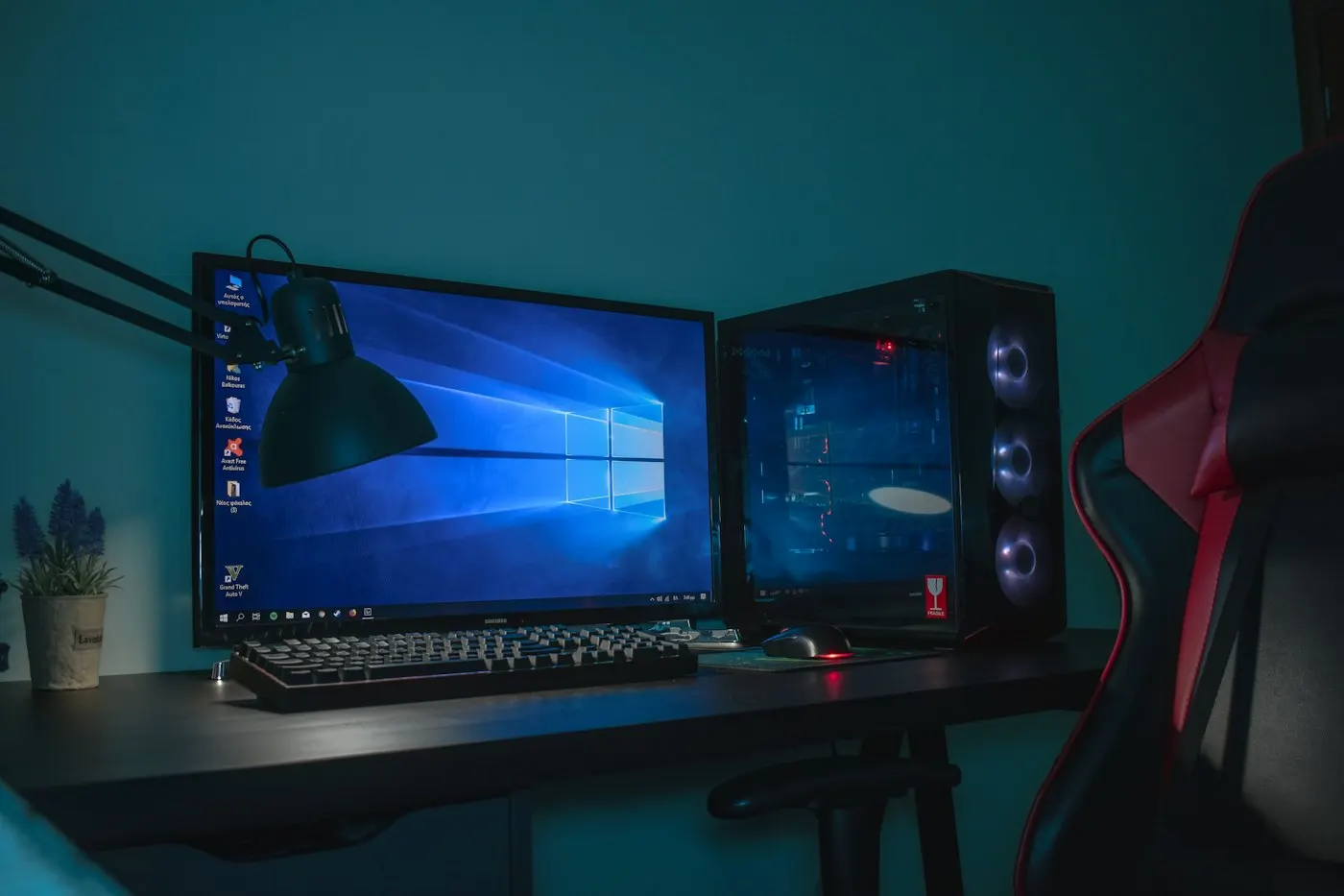 A gaming PC desk with a microphone and monitor