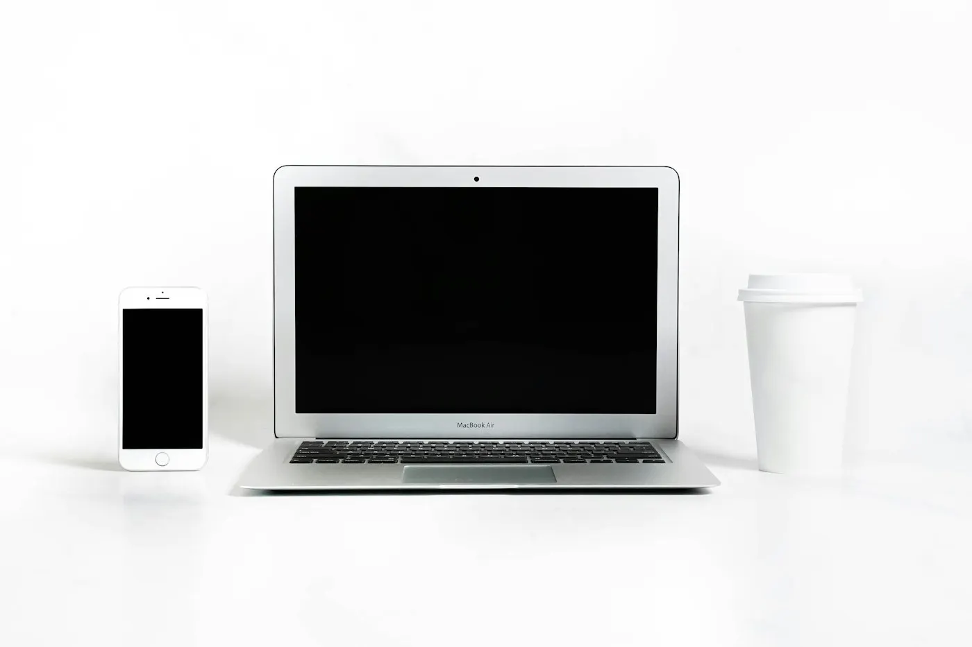 A website layout shown across a smartphone, tablet and laptop