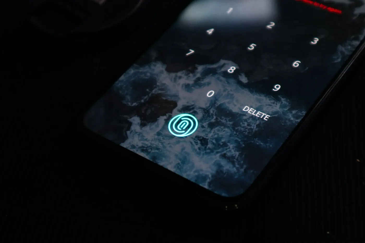 Close-up of a smartphone lock screen showing a privacy symbol