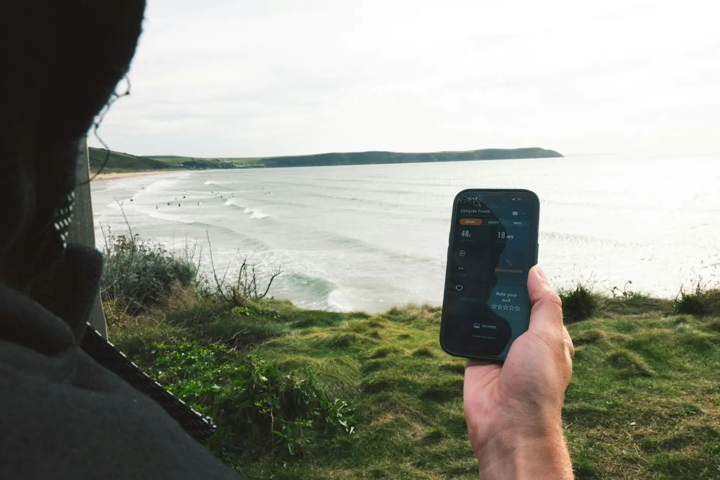 Person using a smartphone on a mobile network outdoors