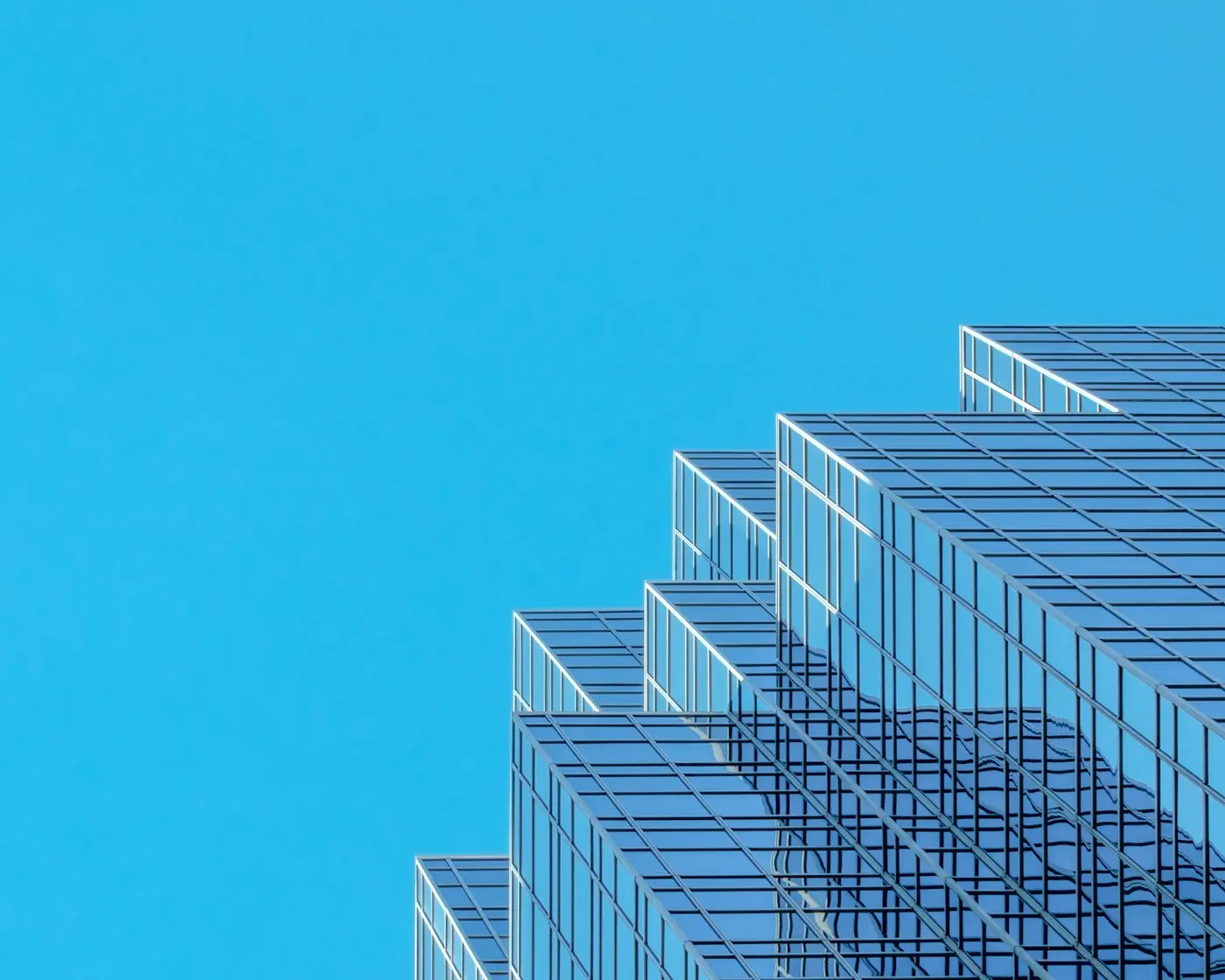 Glass facade of a modern corporate office building