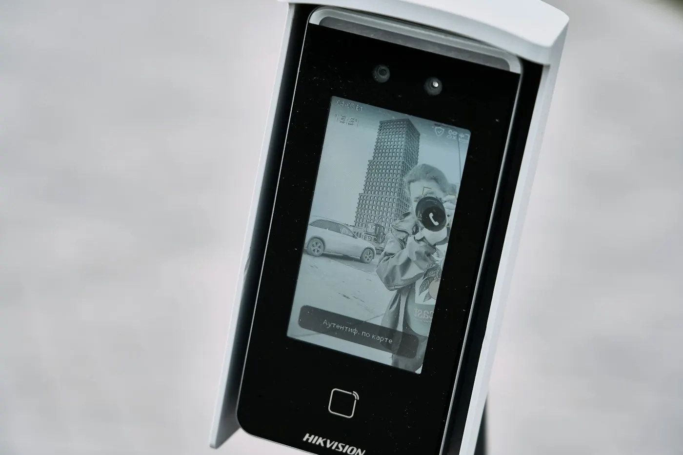 A finger scanning a smartphone fingerprint sensor
