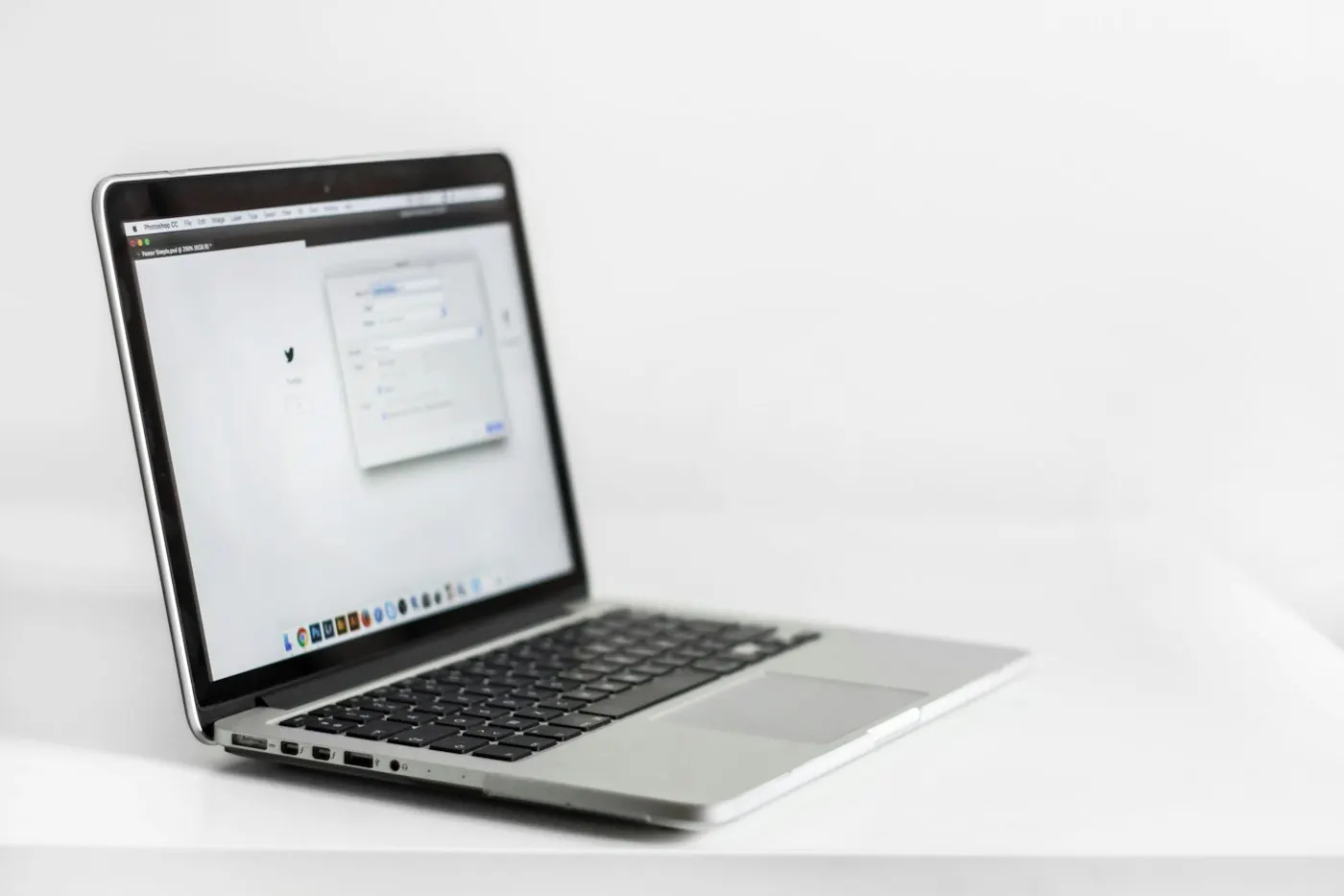 Laptop screen showing a browser window and a code editor