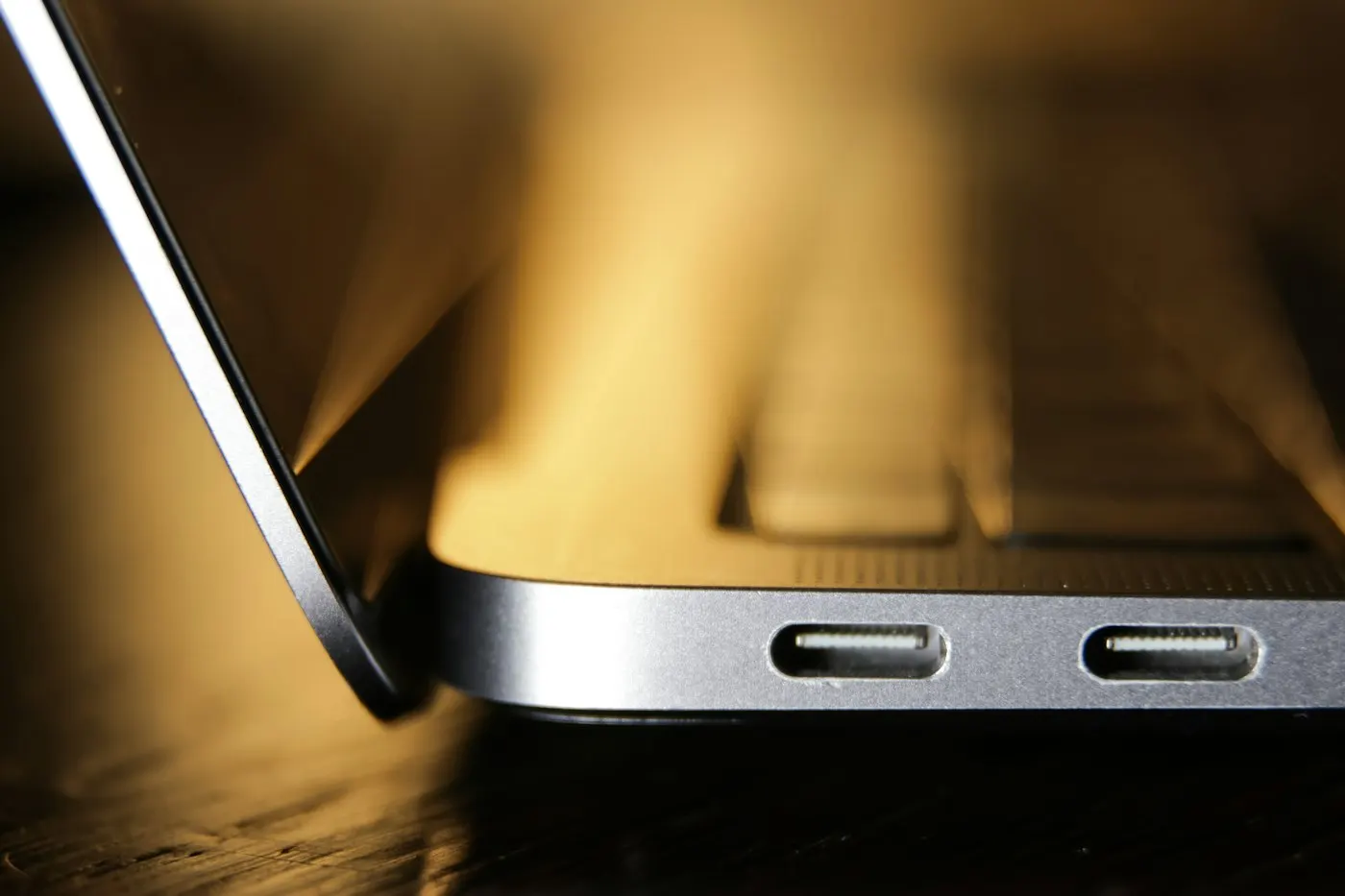 Close-up of a laptop USB-C port with a cable plugged in