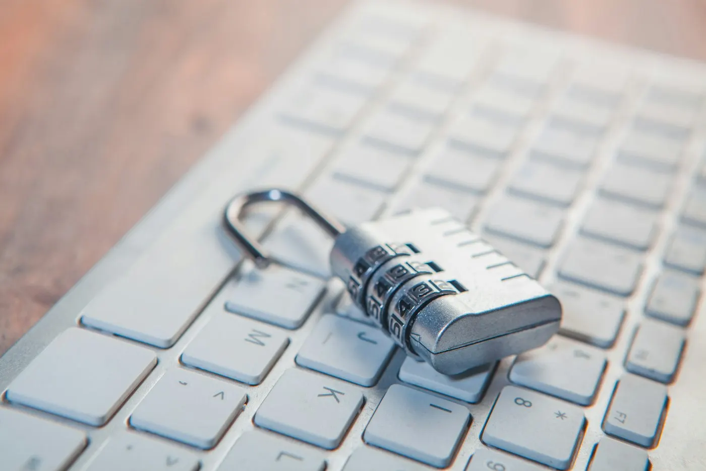 A padlock resting on a laptop keyboard