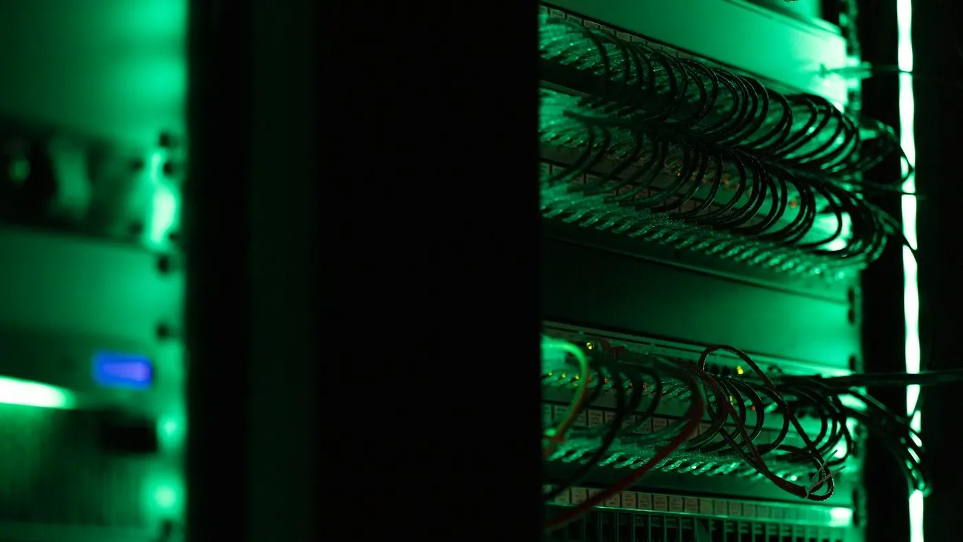 Rows of illuminated servers in a data center