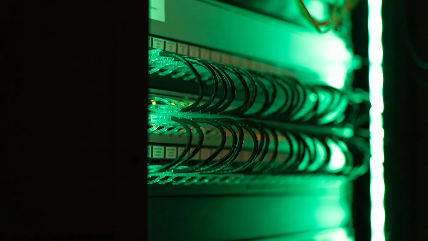 Rows of illuminated servers in a data center