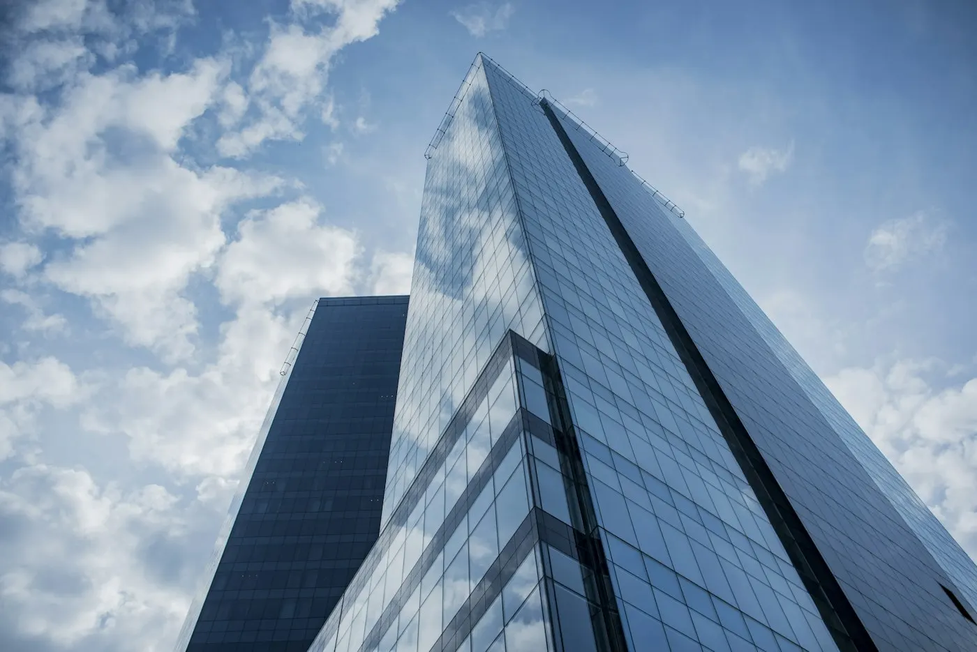 Glass skyscraper facade against the sky