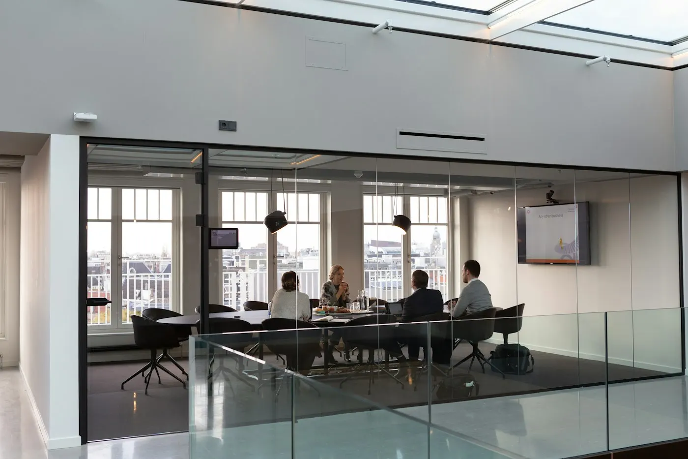 Colleagues in a meeting around a conference table