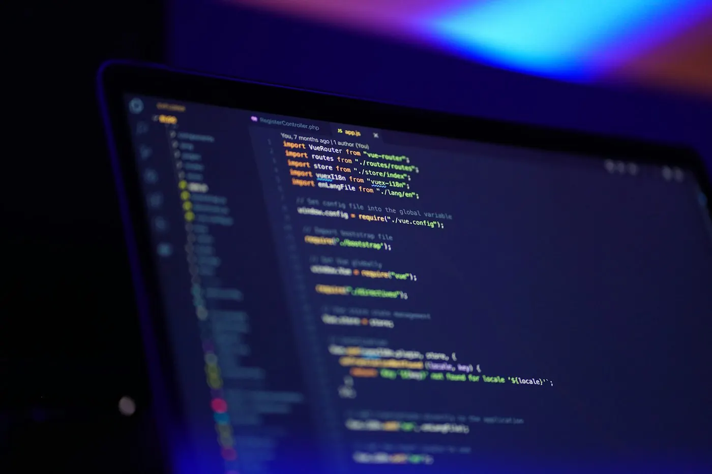 Developer working at a monitor with code on screen