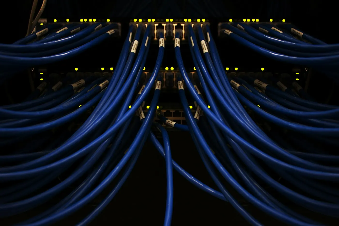 Close-up of tangled network cables in a server rack