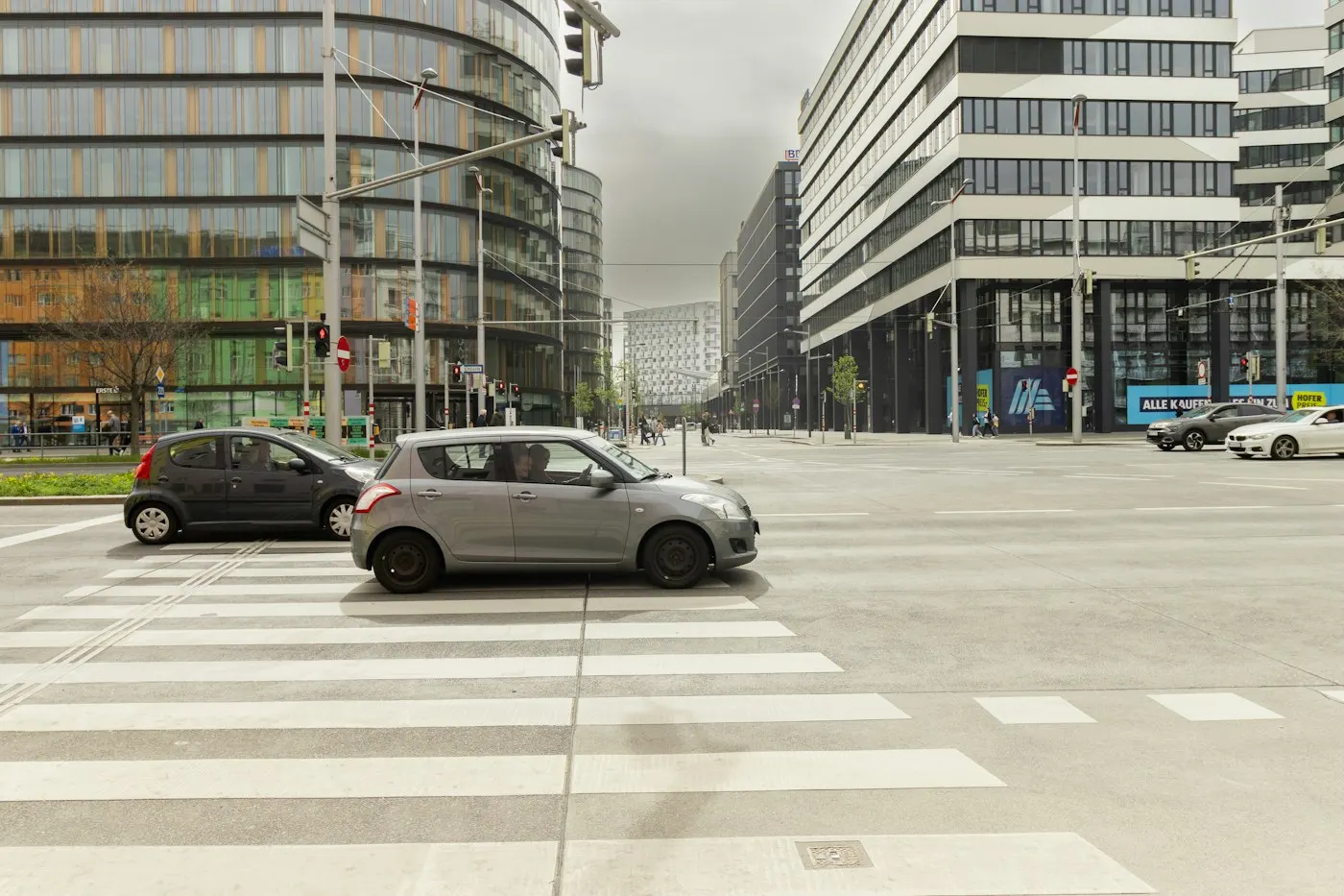 Cars parked along a European city street