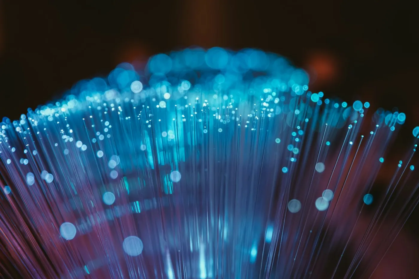 Macro close-up of illuminated fiber optic cables
