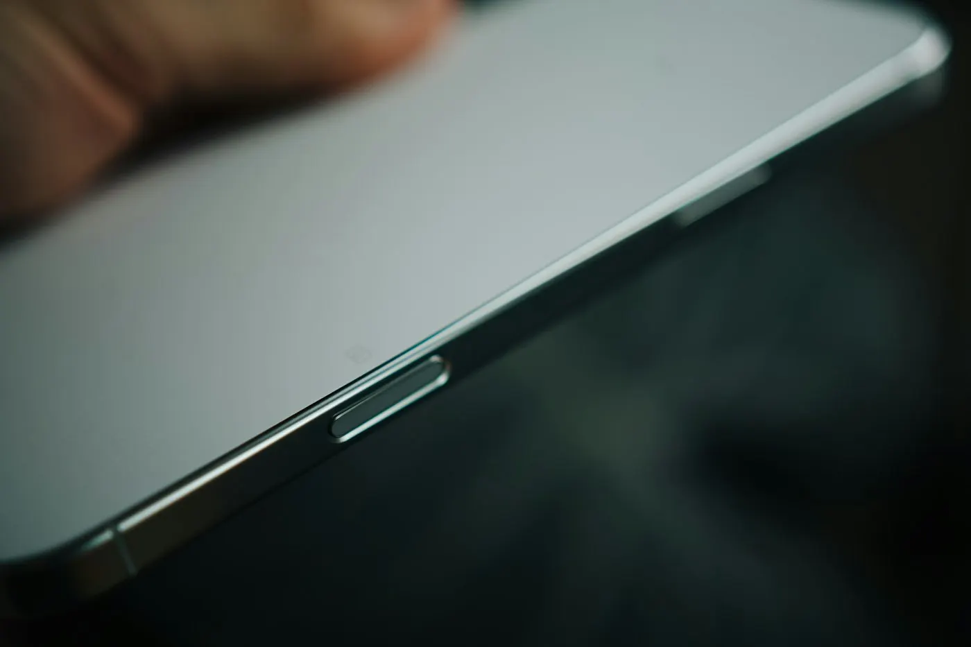 A folded smartphone display showing a visible crease line