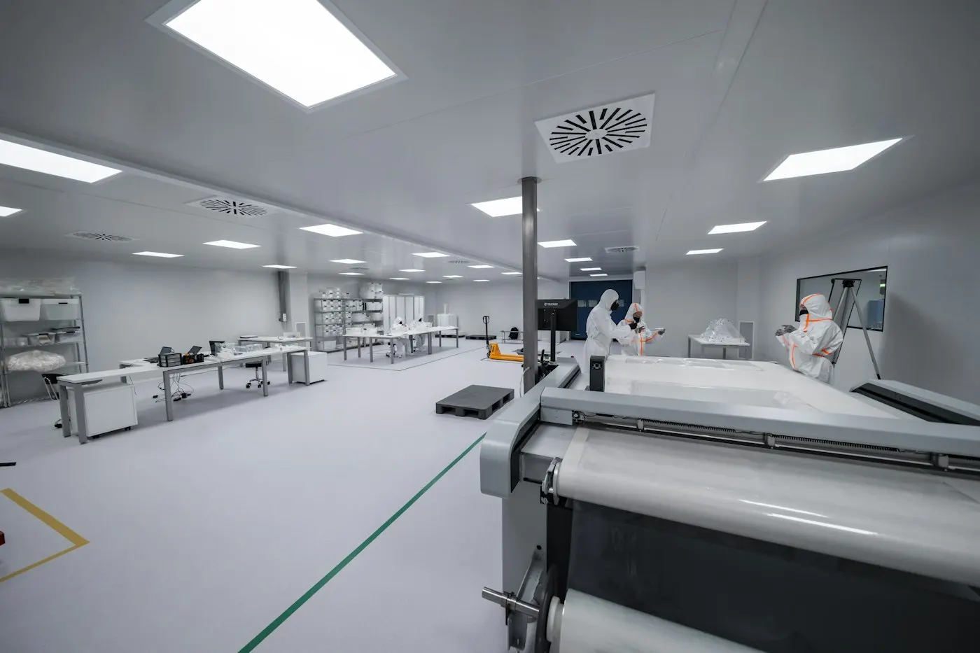 Worker in a semiconductor clean room suit